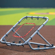 Large rebounder with silver frame and red target on field front angle setup for fly balls