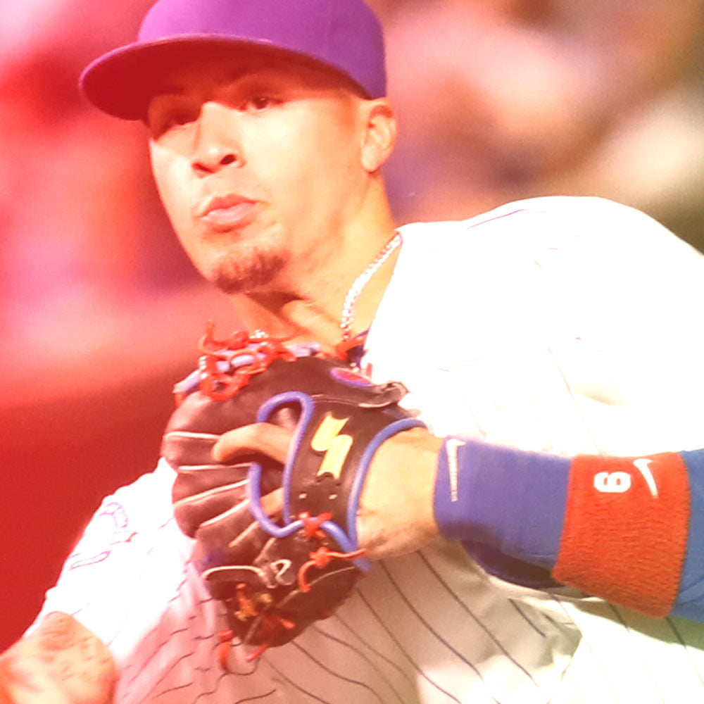 Javier Baez wearing SSK glove and throwing ball